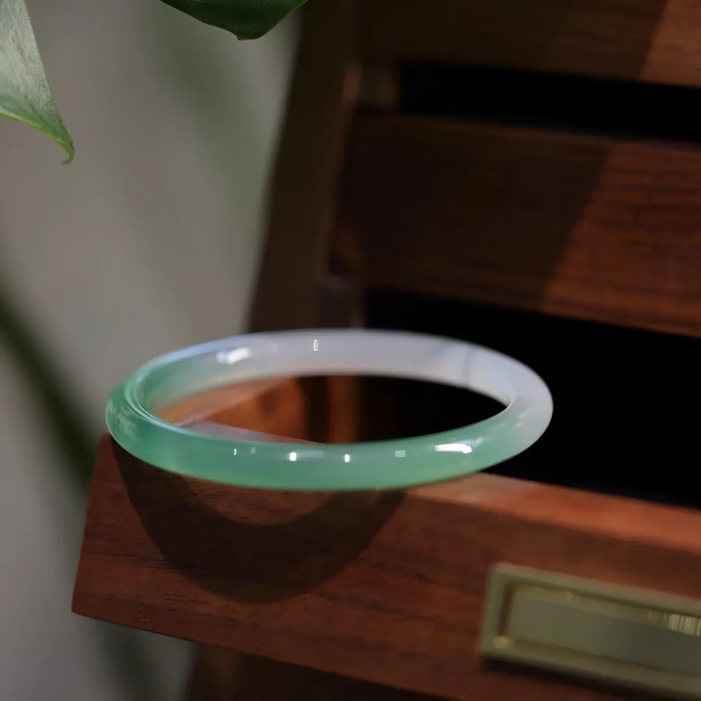 Chalcedony jade bracelet showing natural stone colour and texture, displayed with size markers