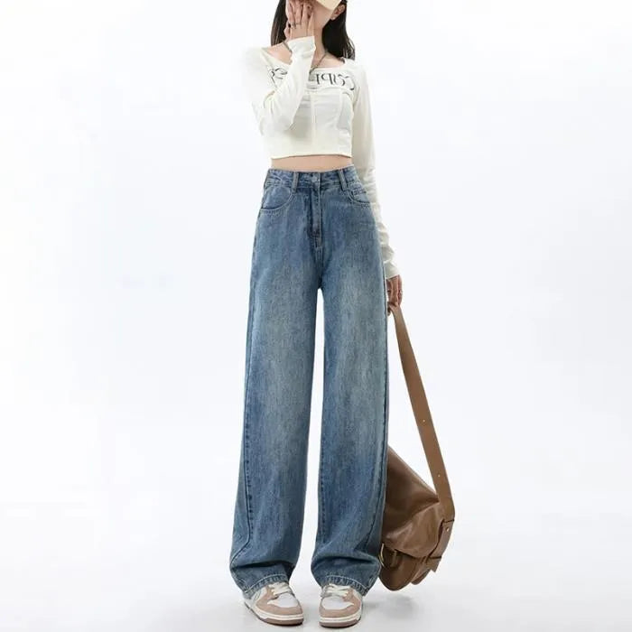 Retro blue high-waist wide leg jeans on a hanger showing straight leg trouser cut.