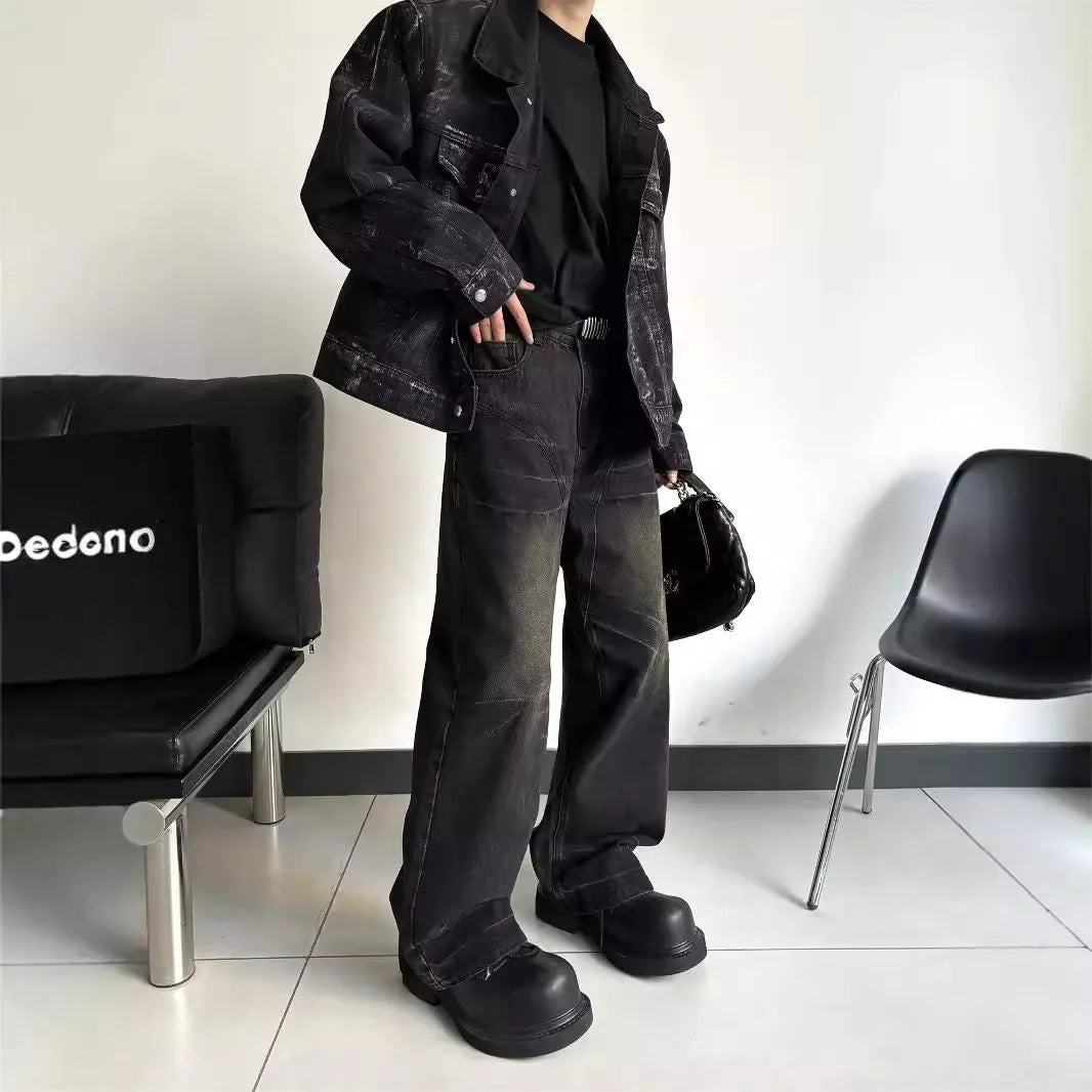 Mens washed black straight leg denim jeans with dirty mud texture and zip fly