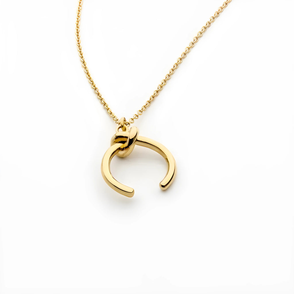 Geometric copper pendant necklace on a cross chain with gold or silver electroplated finish.
