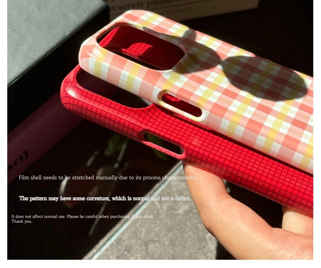 Original plaid design iPhone 15 Pro Max phone case in red and orange grid patterns with frosted and glossy finish options.