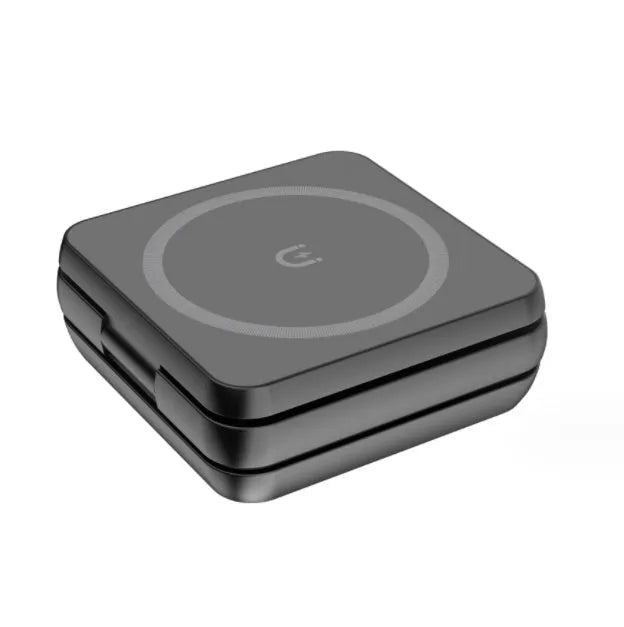 Folding three-in-one desktop wireless charging bracket with magnetic ring on a desk.