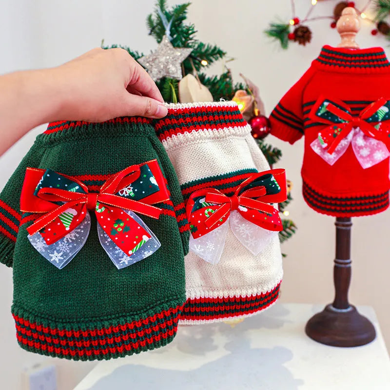 Red and green Christmas dog jumpers with festive print on a small dog model.