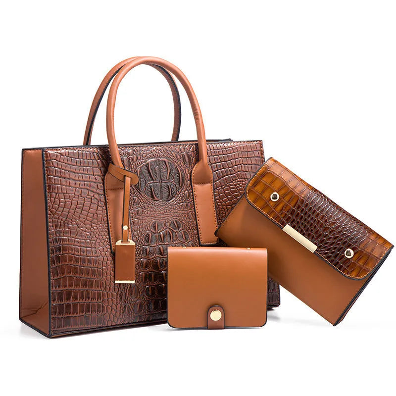 Women's three-piece PU leather handbag set with crocodile pattern in four colour options showing interior zippered compartment