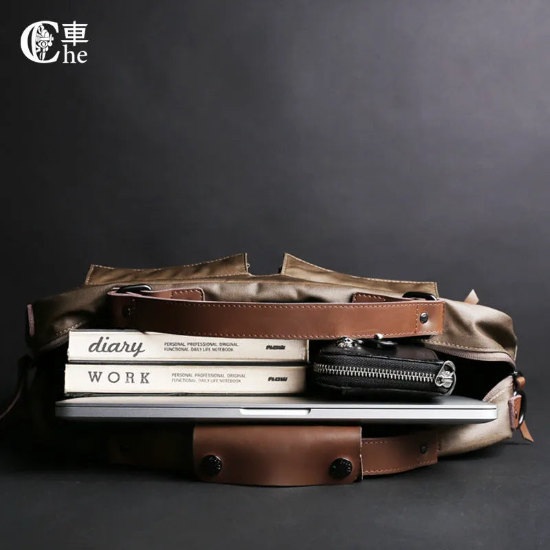 Dpark black single shoulder sling laptop bag for 14 or 15 inch devices on a table