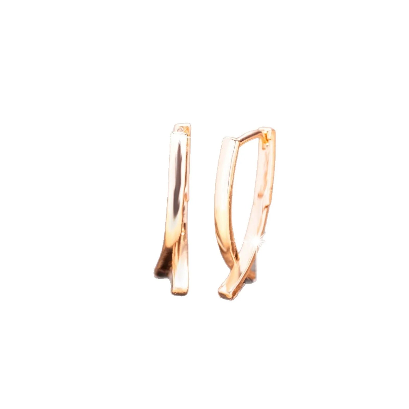 Rose gold coloured cross shaped earrings for women made from copper.