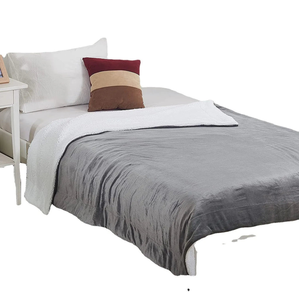 Grey and white USB-powered flannel electric heating blanket laid flat.