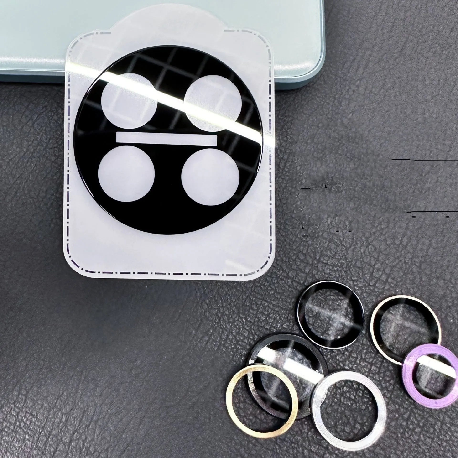 Tempered glass lens protector with black ring for OnePlus 12, Find N3, and OnePlus 11 smartphones.