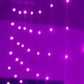 Copper curtain design LED fairy lights with USB plug, shown in blue colour draped decoratively.