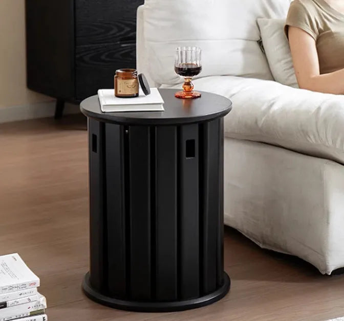 A stackable round metal dining stool in a modern style, shown in a choice of colours.