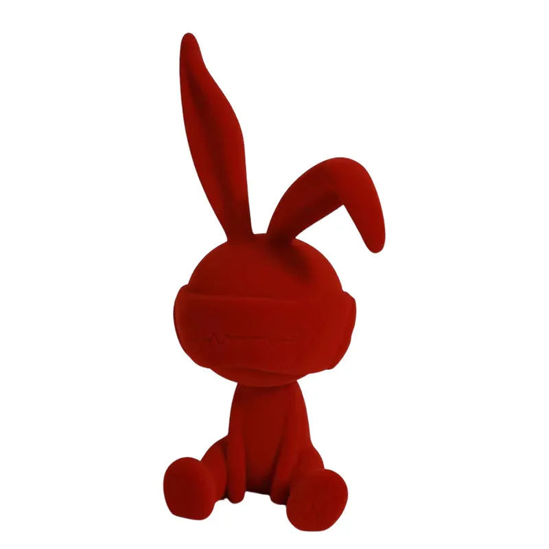 Resin rabbit table ornament with a suede blindfold in green, blue, or red colour options.