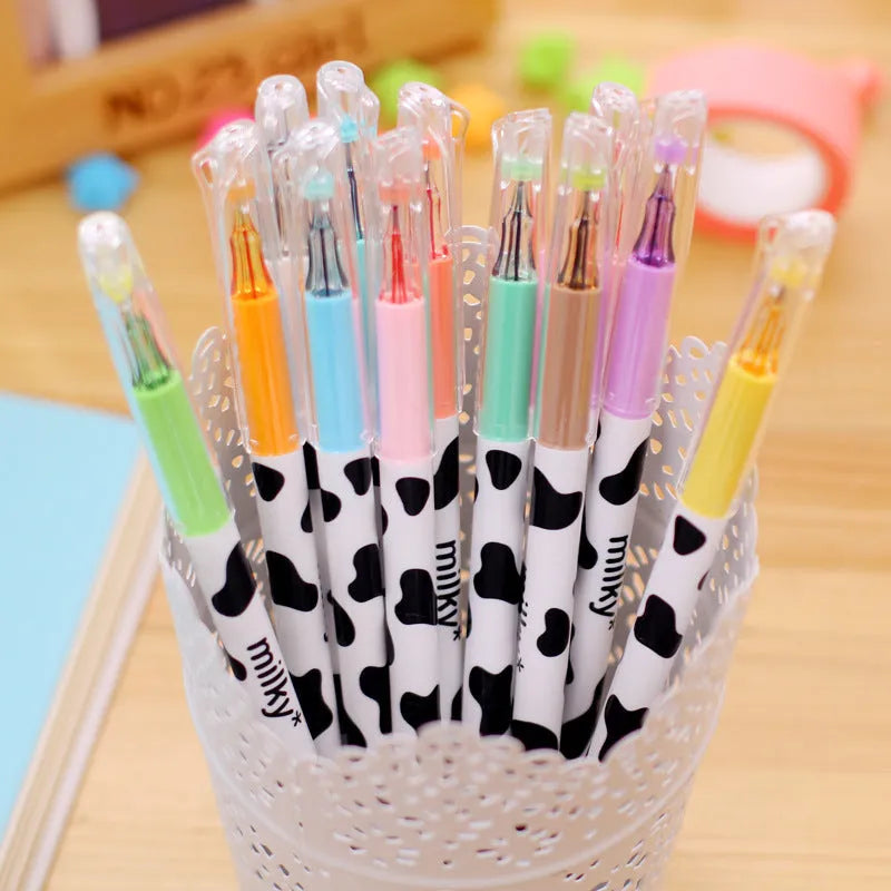 Box of 12 cow print gel pens with 0.38mm fine tips in assorted colours.