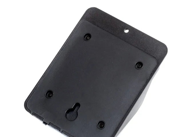Silver outdoor solar-powered LED sensor light mounted on a wall with four illuminated bulbs.