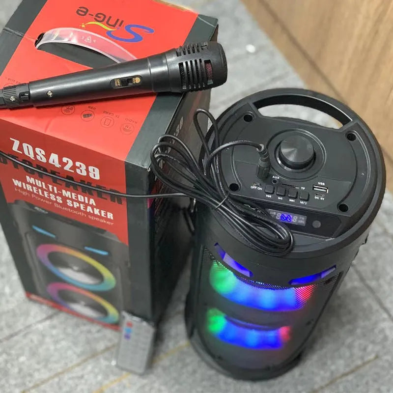 Black portable Bluetooth speaker with colourful dual horns, showing front panel with controls.