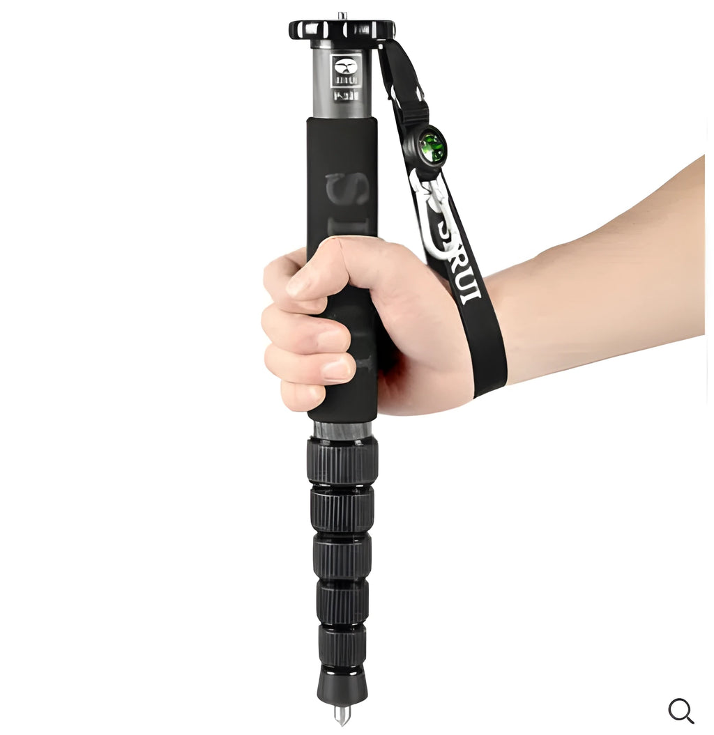 Black carbon fibre telescopic monopod for DSLR cameras extended to full height