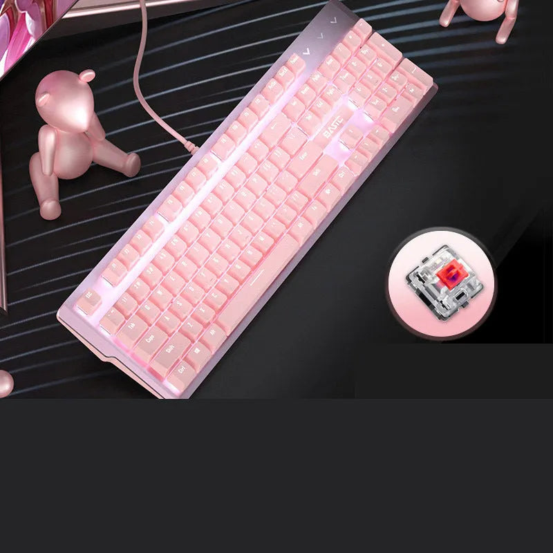 Girly pink coloured 104-key wired mechanical keyboard on a desk