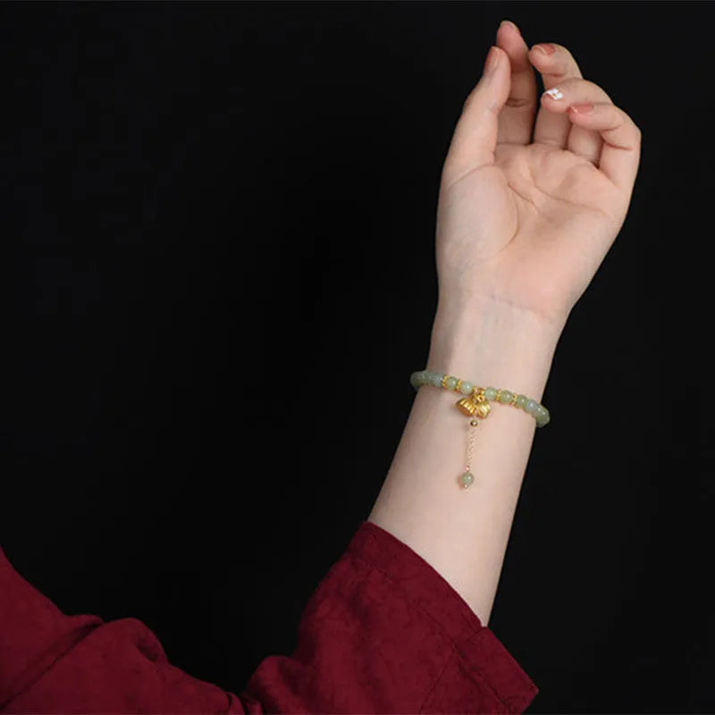 Natural Hetian jade bracelet with 6mm lotus beads and fu character element