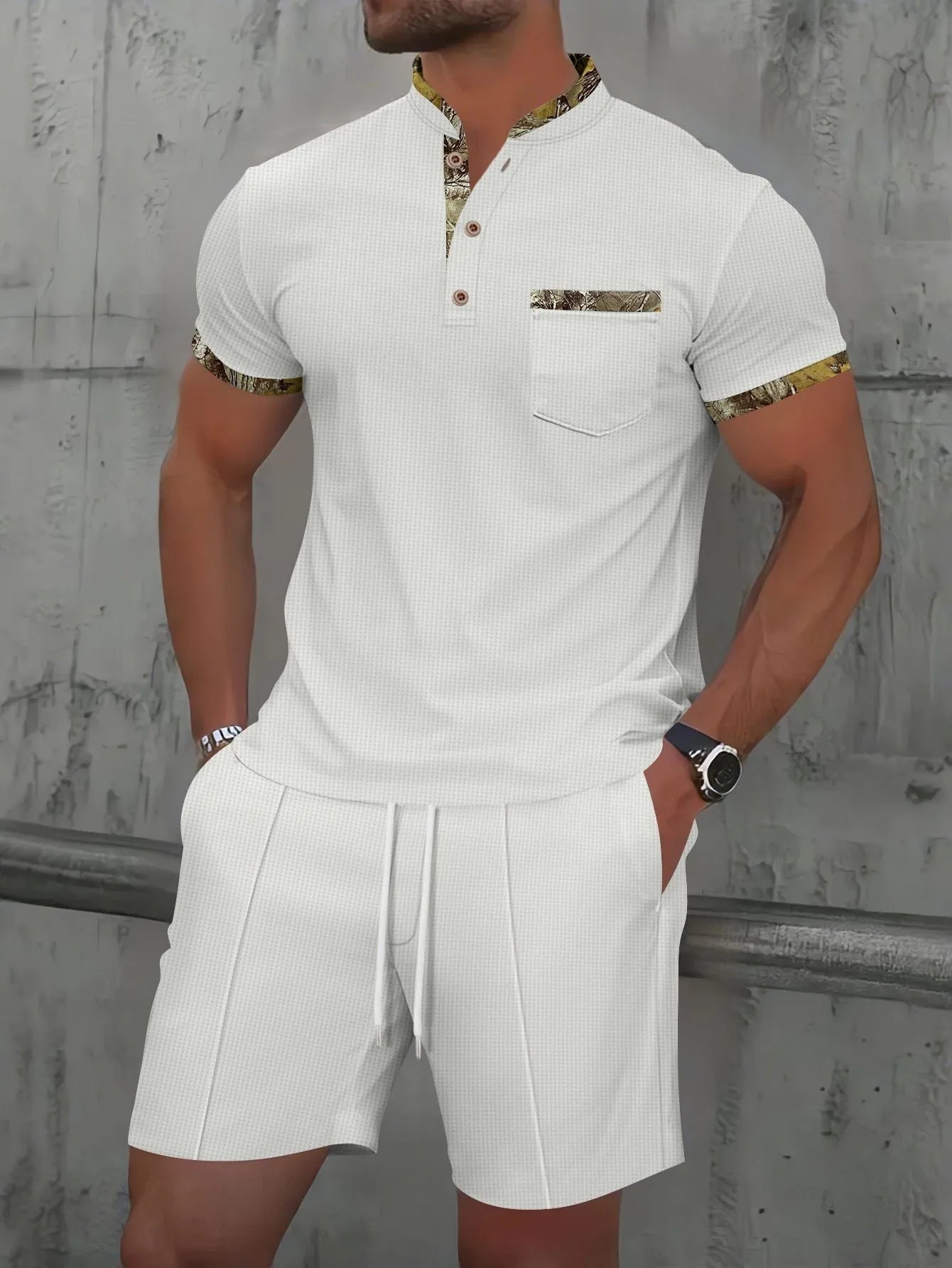 Men's grey waffle weave zippered polo collar short sleeve top and matching shorts suit set laid flat.