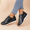 Women's black thick-soled casual sneakers with a square toe and PU leather upper.