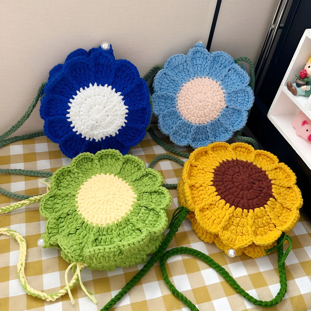 Hand-woven crochet bag with wool flowers in round suitcase shape with cotton lining