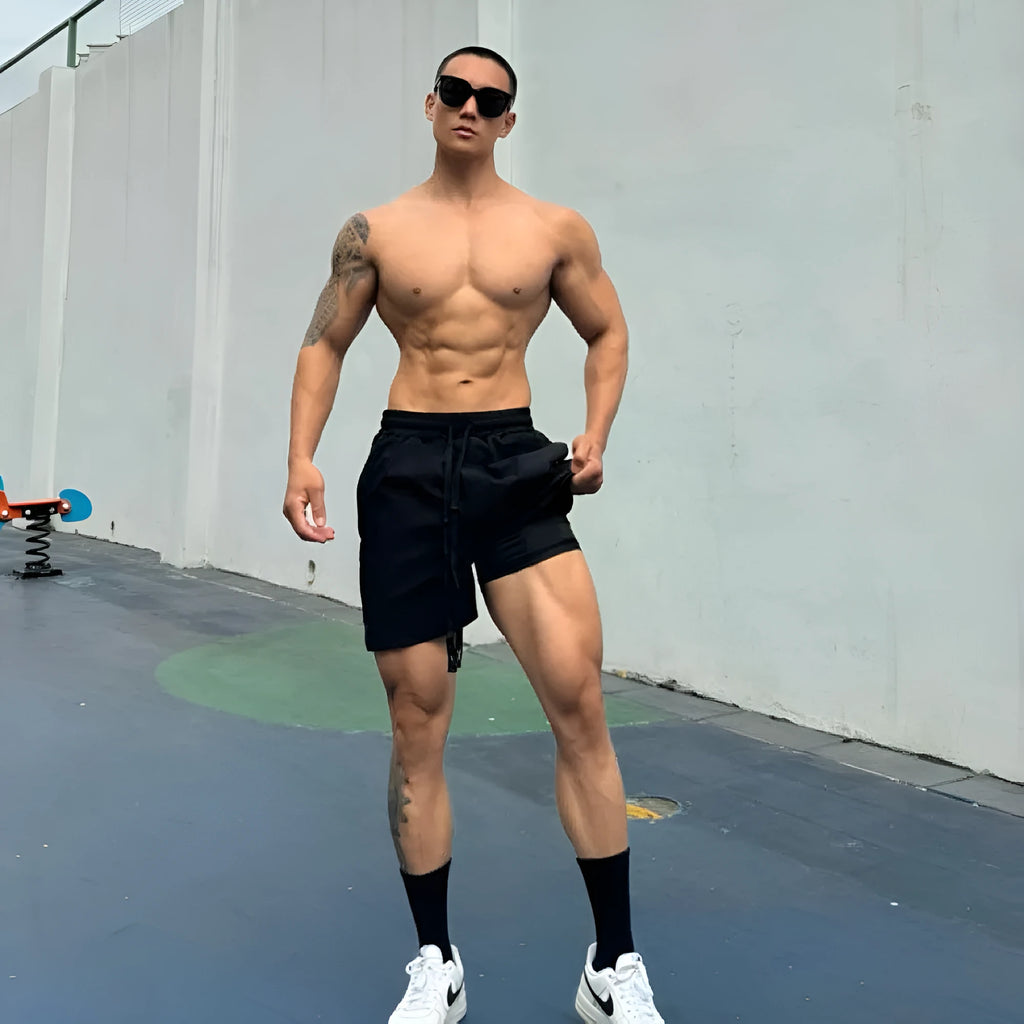 Man wearing grey ice silk quick-drying double-layer quarter-length casual shorts.