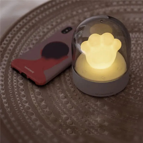 Pink cat paw shaped night light with USB charging cable and music box function