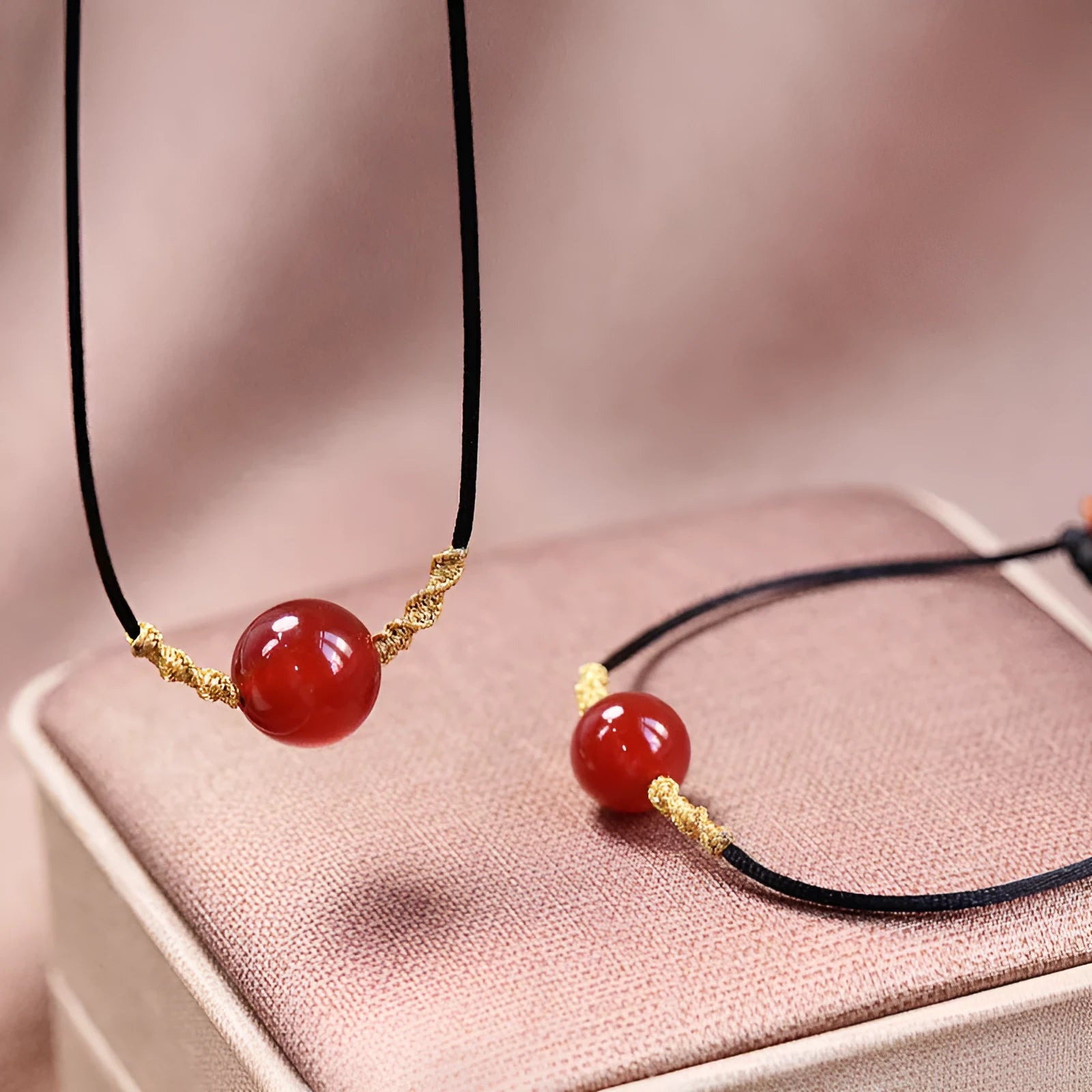 Hand-woven red agate bracelet and necklace set for women in a national style with bead details.