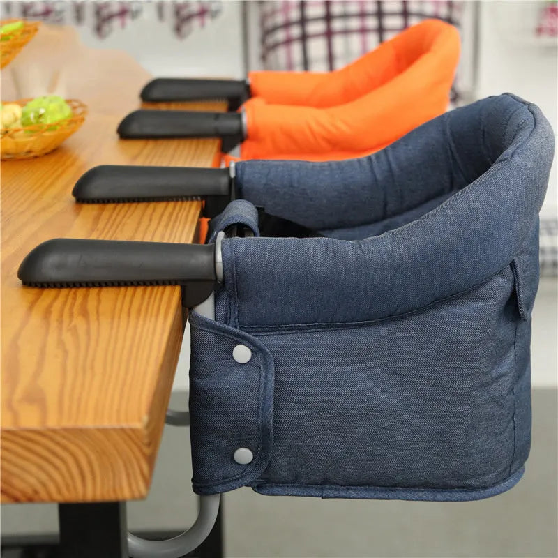 Portable baby dining cover seat with safety belt on a dining chair