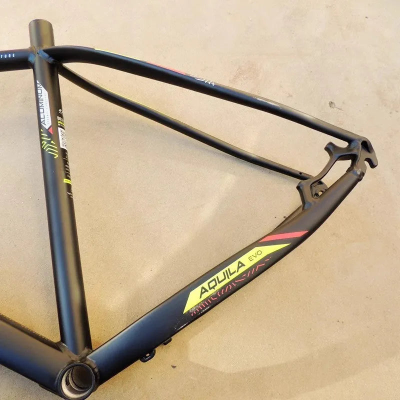 Black green 29-inch aluminium mountain bike frame showing disc brake mounts and inner line routing