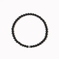 Electroplated agate obsidian blue San bracelet with 4mm geometric beads on wrist