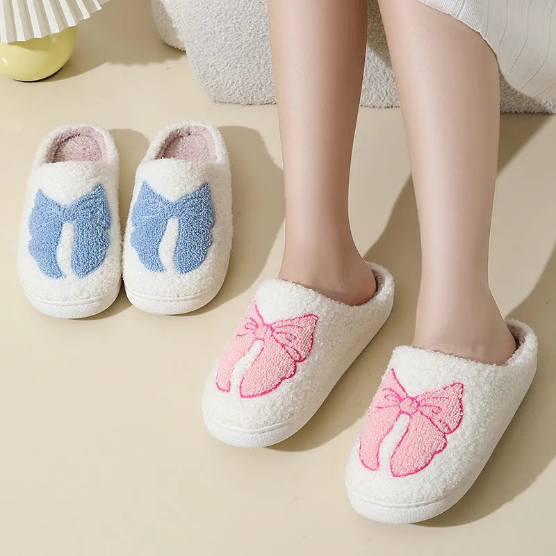 Cartoon bow knot cotton slippers in blue with suede upper and TPR sole.