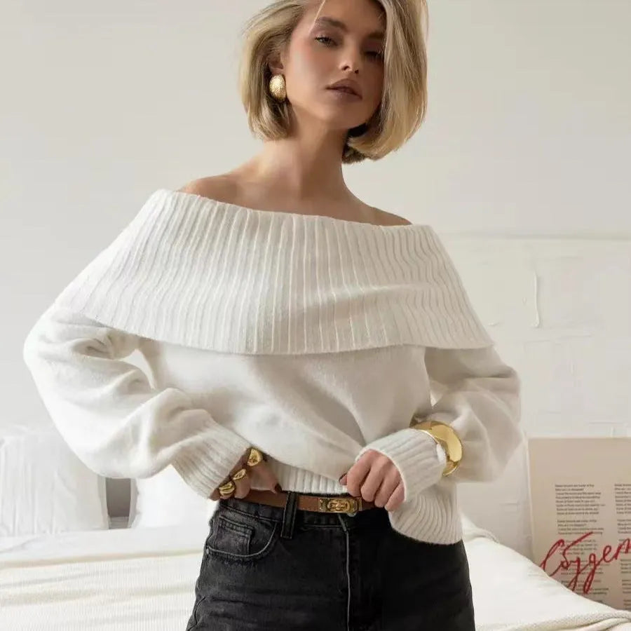 Grey off-the-shoulder strapless sweater with a 3D textured pattern, shown on a model.