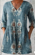 Women's loose-fitting dress with a wave print pattern, wide waist, and three-quarter length sleeves.
