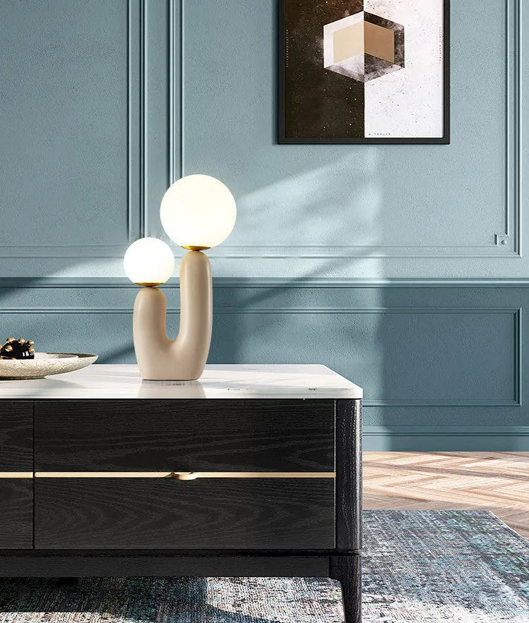 Pink double-head resin table lamp with glass shades on a bedside table, 49cm height