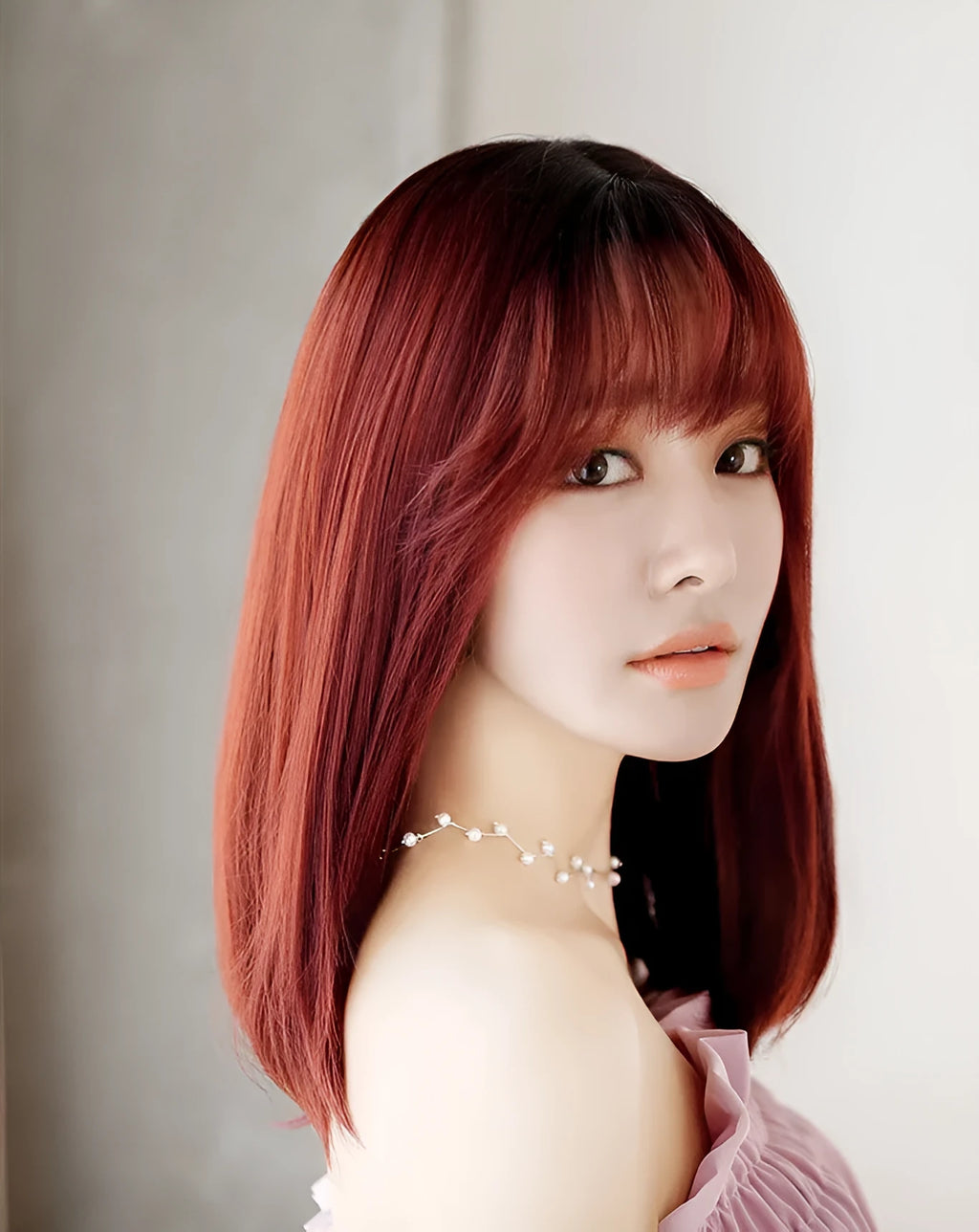 Long straight synthetic wig in 45cm length with adjustable buckle, available in multiple colours