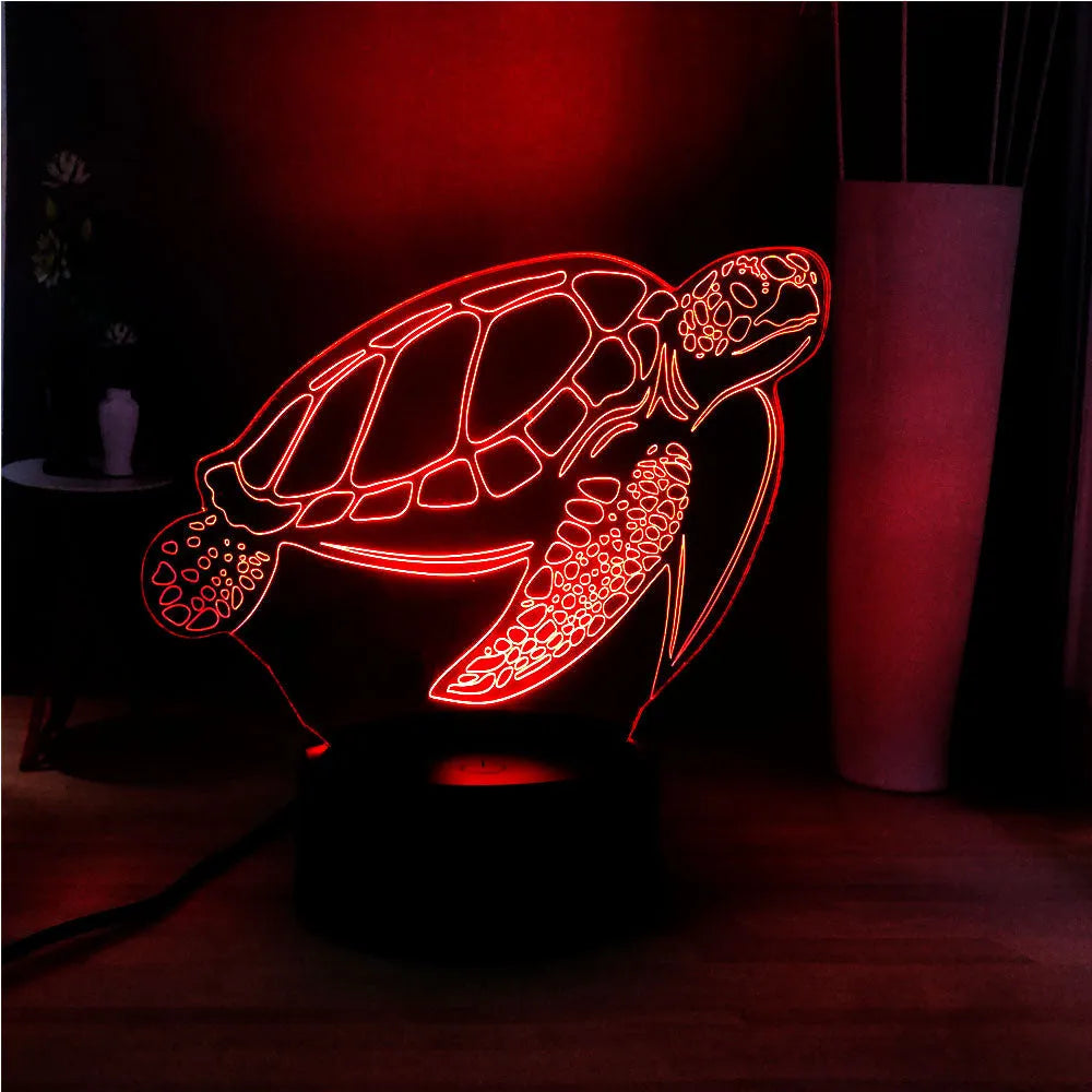 3D transparent acrylic turtle-shaped LED night light glowing with coloured light.