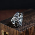 Silver open ring with a jibeast pattern, animal zodiac modelling, and a personalised diamond element.