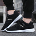 Breathable mesh walking shoes for elderly with non-slip soft sole in black, unisex lace-up design