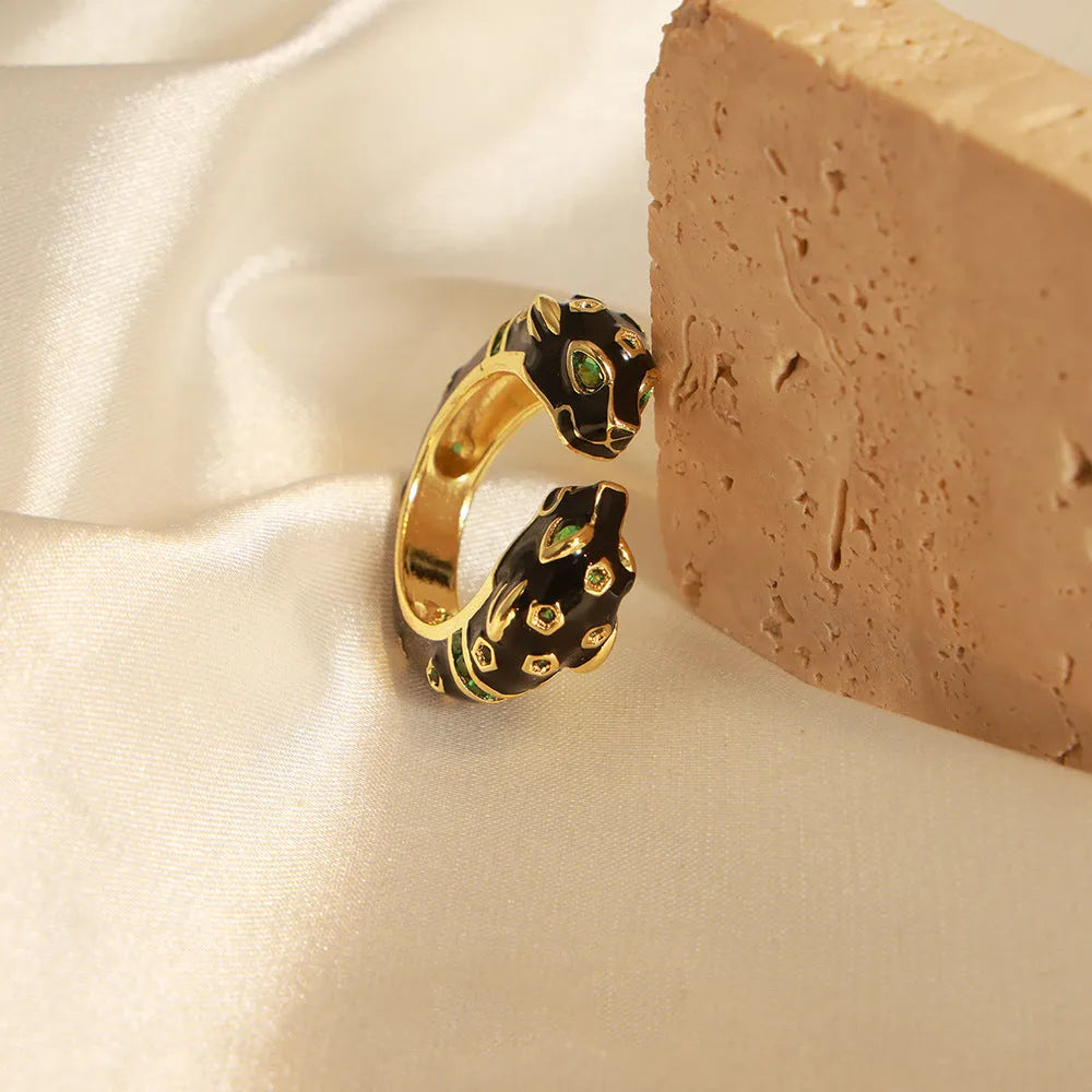 Women's geometric open ring with black electroplated cheetah drip pattern design, size 7