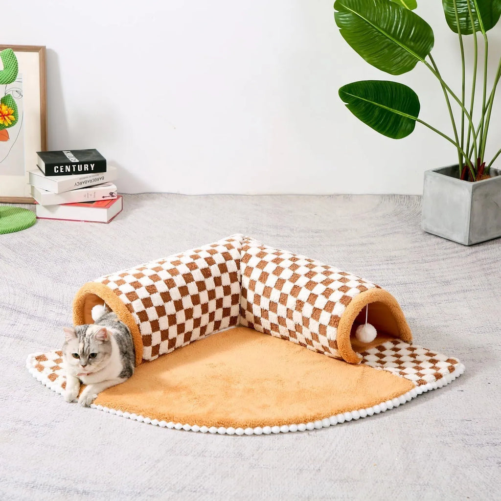 Fan shaped plush pet bed with integrated tunnel in plaid design, shown in coffee colour.