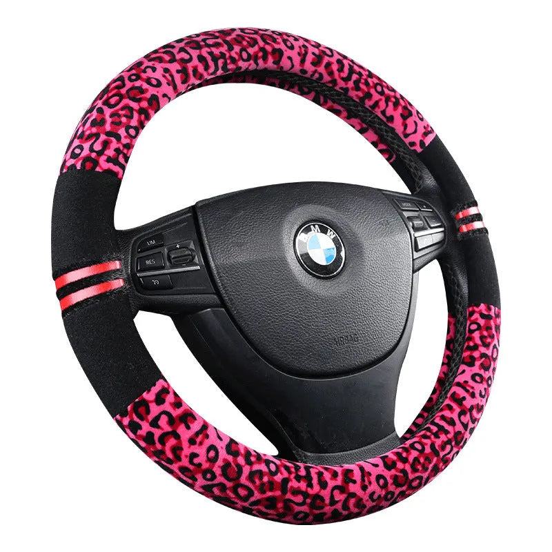 Winter plush car steering wheel cover in beige with leopard grain pattern on a GM steering wheel