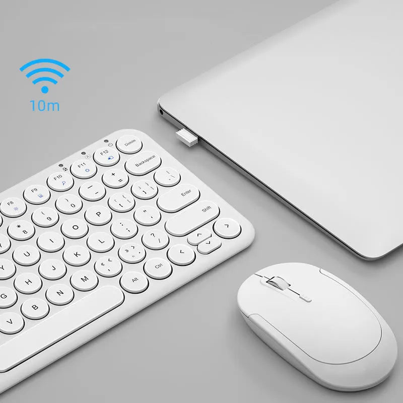 White ultra-thin wireless keyboard and mouse set on a desk.