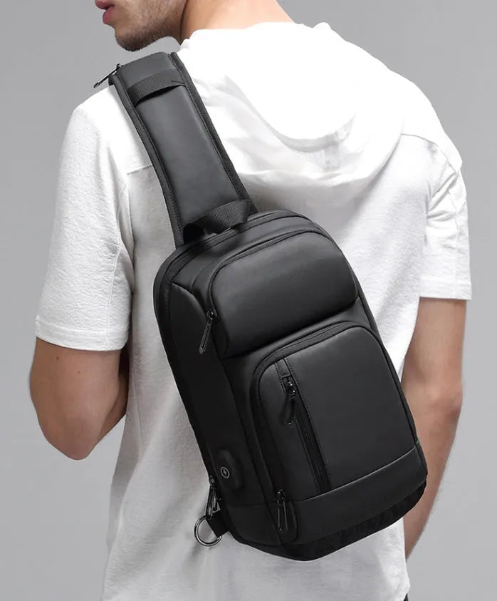 Black medium outdoor shoulder bag with air cushion strap and internal organisers
