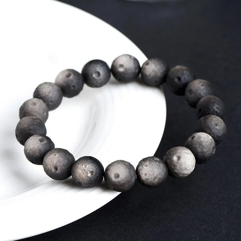 Natural obsidian crater ball bracelet with textured beads in silver or gold meteorite finish