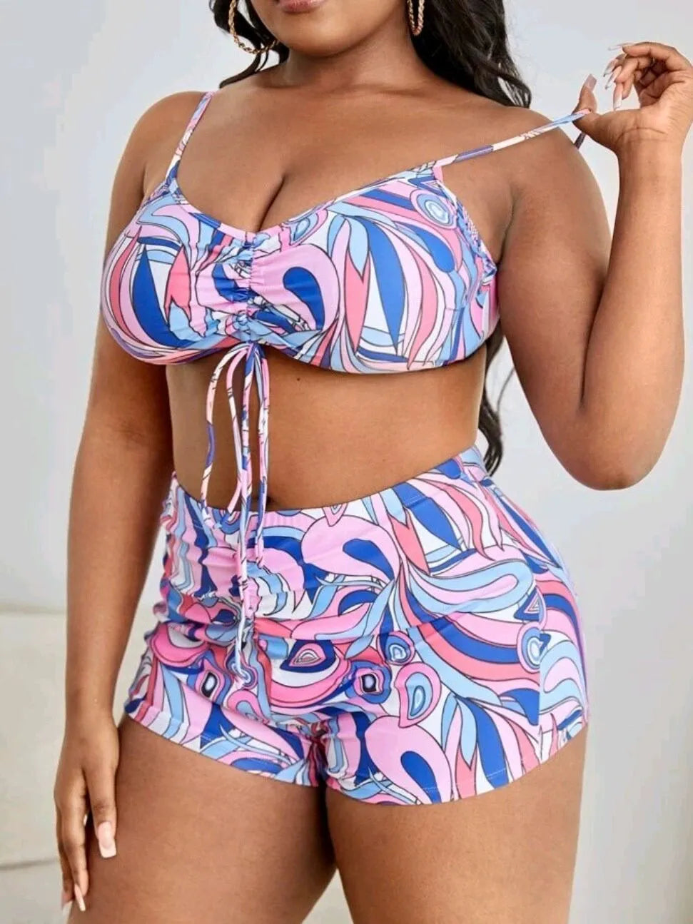 Women's floral print bikini three-piece set with bra, briefs, and cardigan cover-up.