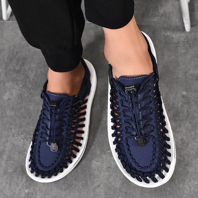 A pair of casual woven Roman sandals with an elastic drawstring tie across the instep.