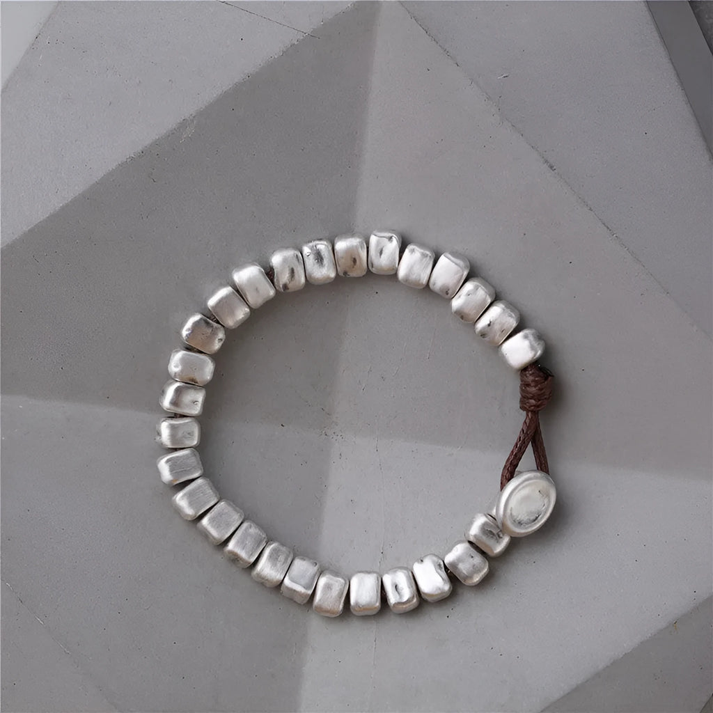 Handmade women's bracelet with silver squares and wooden beads on elastic cord