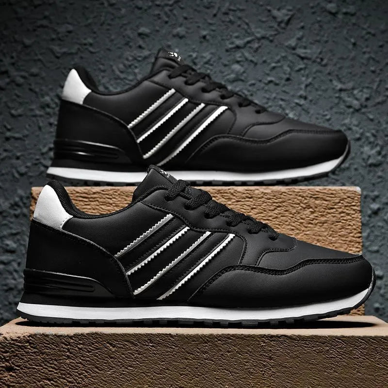 Black men's sports casual leather shoes with a carved wing pattern and a super high heel.