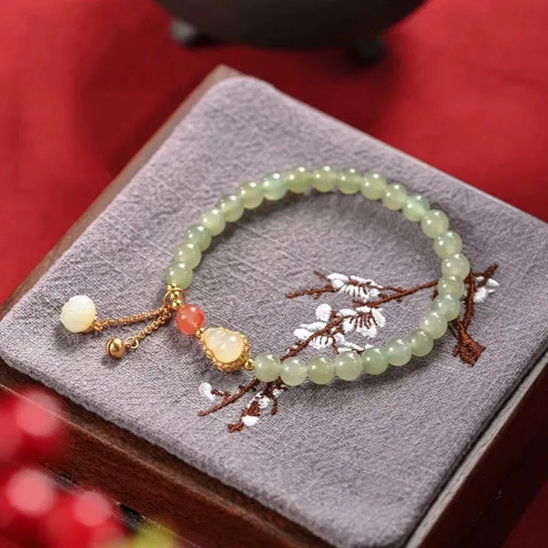 Qingshui jade women's bracelet with gold-plated gourd charm and fu character