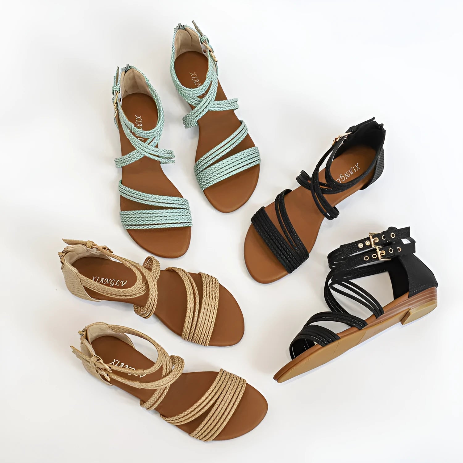 Women's black open-toe Roman sandals with cross straps, wedge heel, and back zipper.
